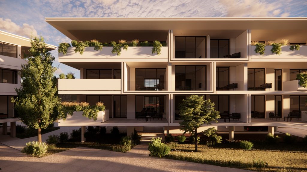 בט חזיתי על בניין מגורים בפרויקט The King Residences בפאפוס, עם מרפסות ירוקות ועיצוב מודרני